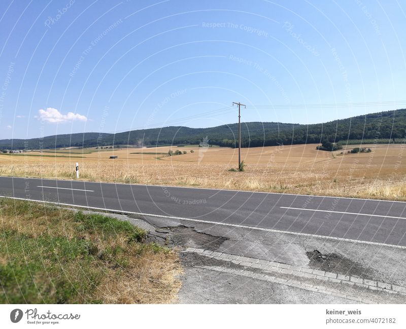 Road damage in the heatwave summer and desolate farmland after the harvest road damages Hot summer Arable land Harvest Landscape Agriculture Rural Field country