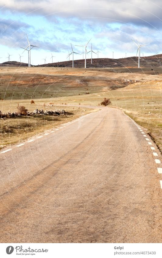 Landscape with wind park windmill wind-turbine energy environment renewable road alternative blue climate conservation development ecology efficiency electric