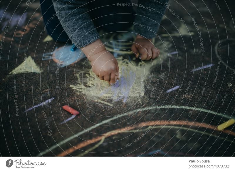 Child drawing with colored chalk on the floor Close-up childhood Draw Drawing Chalk Chalk drawing Painting and drawing (object) Playing Creativity Street Art