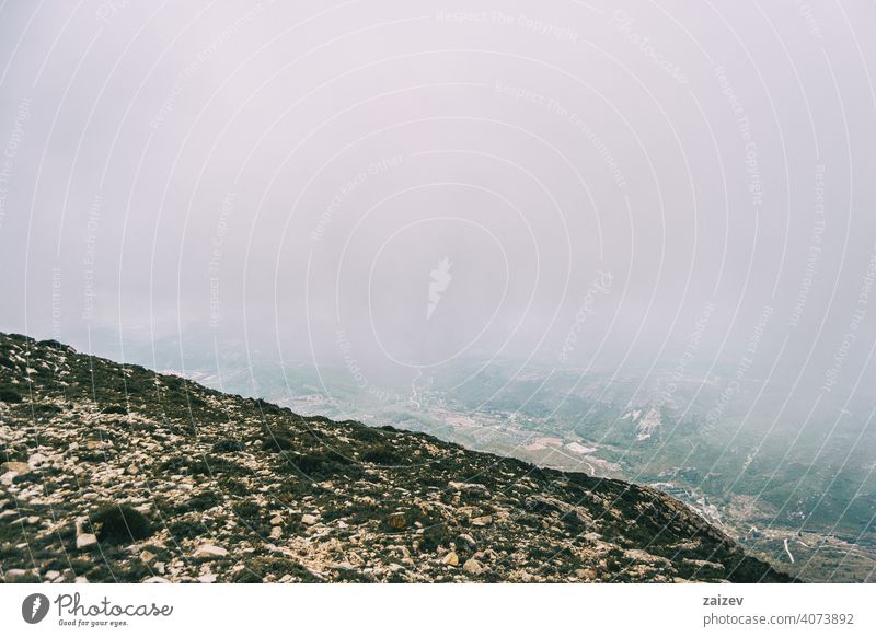 cloudy day with fog in the mountains of the natural park of the ports, in tarragona (spain) eroded layered canyon nature outdoors travel destinations descent