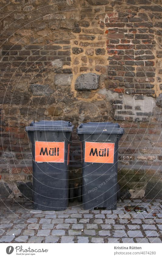 two grey garbage cans with the inscription garbage Trash dustbin Waste bins sign stickers Inscription litter bins rubbish bin Household garbage grey bin