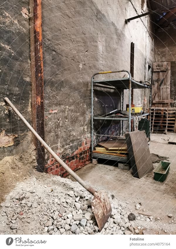 Lost - part of an old factory building with a shelf, a pile of rubble and a shovel lost places Architecture Derelict Ravages of time Apocalyptic sentiment