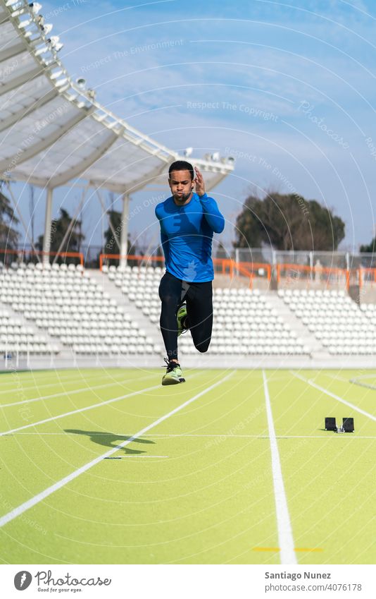 Side View of Athlete Doing Sprint one person black man african american jump training side view exercise athleticism jumping run running lifestyle healthy fit