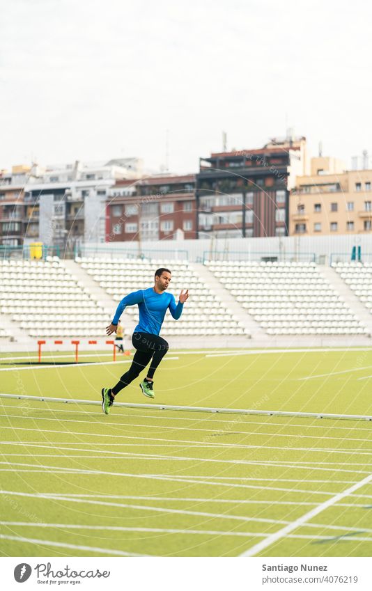 Side View of Athlete Doing Sprint one person black man african american jump training side view exercise athleticism jumping run running lifestyle healthy fit