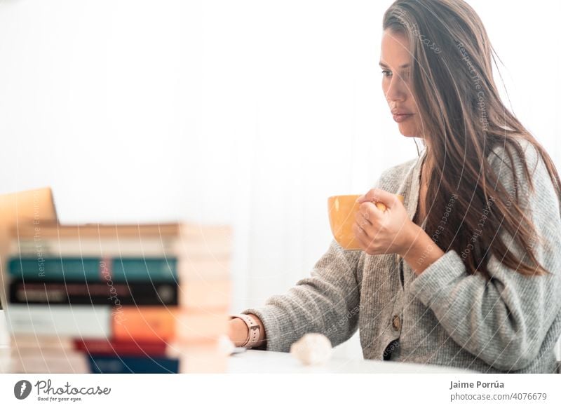 young woman teleworking at home with computer drinking coffee spectacles service one person call communication female businesswoman beautiful european people