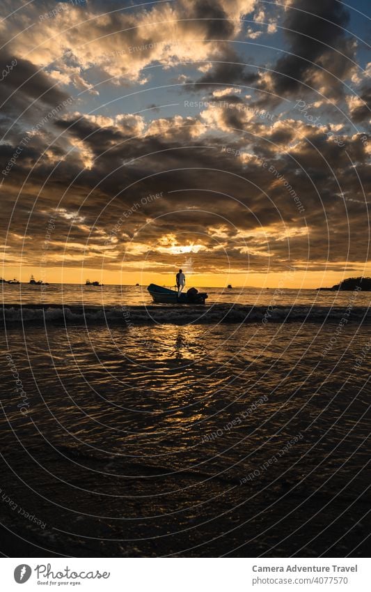 Unrecognizable man standing in the boat looking the sunset vacation people evening sky nature travel person summer background silhouette young light view lonely