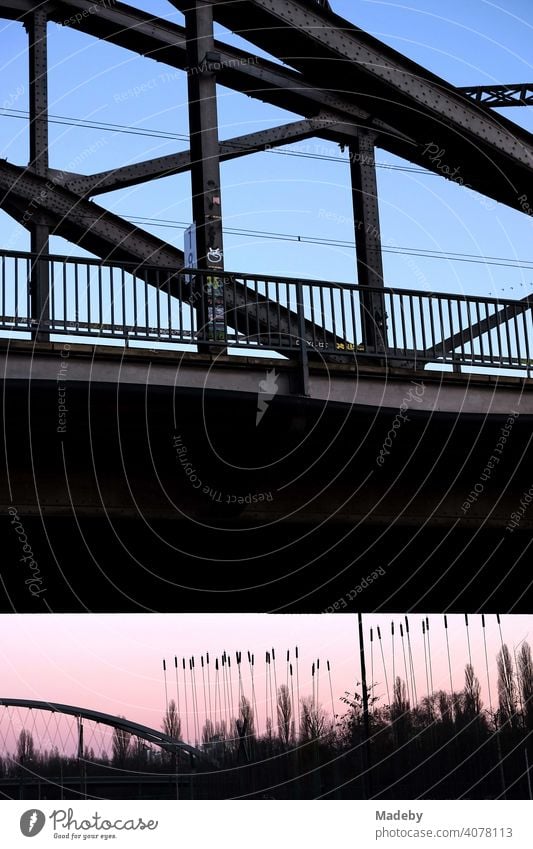 Deutschherrnbrücke and Osthafenbrücke in the light of the setting sun at the Hafenpark at the European Central Bank ECB in the Ostend of Frankfurt am Main in Hesse