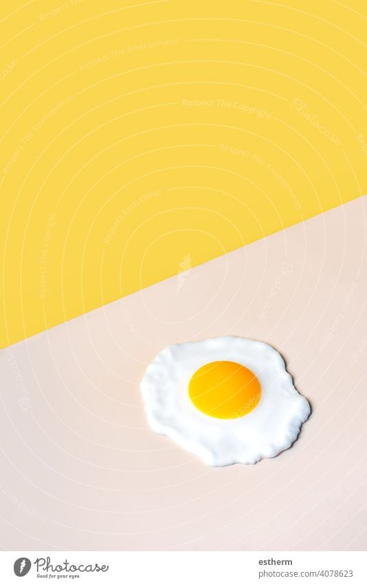 fried egg on a beige background eggs food chicken eggs easter eggs yolk fresh egg yolk eat cooking cholesterol farming farmyard animal egg freshness agriculture