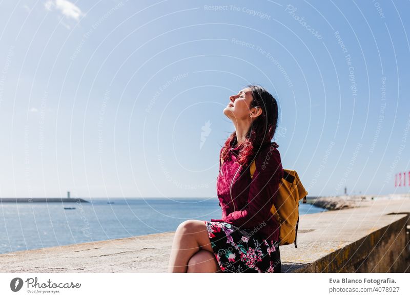 young caucasian backpacker woman sightseeing Porto views by the river. Travel and friendship concept sun travel spring city urban beautiful people tour tourism