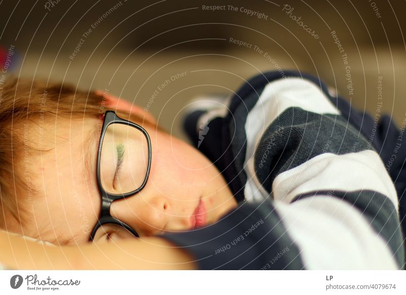 child wearing glasses, sleeping peacefully Symbols and metaphors adorable real real life tranquillity innocence pure soft sweet Dreamily Background picture