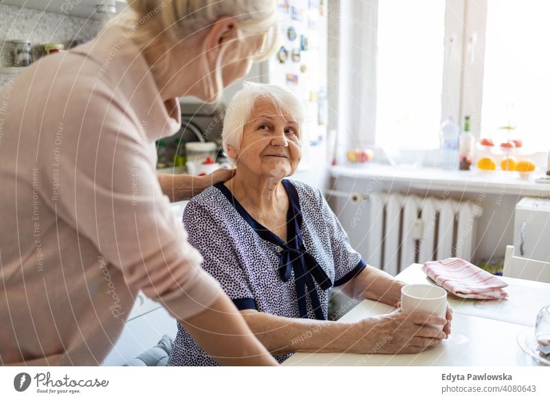 Senior woman spending quality time with her daughter smiling happy enjoying positivity vitality confidence people senior mature casual female Caucasian elderly