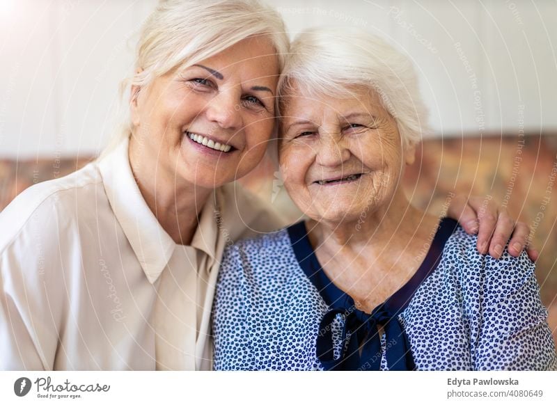 Senior woman spending quality time with her daughter smiling happy enjoying positivity vitality confidence people senior mature casual female Caucasian elderly