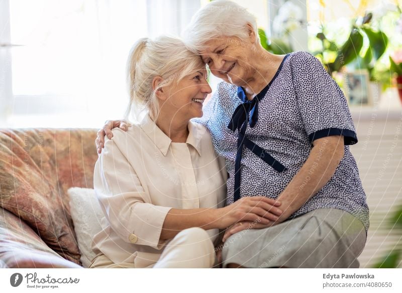 Senior woman spending quality time with her daughter smiling happy enjoying positivity vitality confidence people senior mature casual female Caucasian elderly