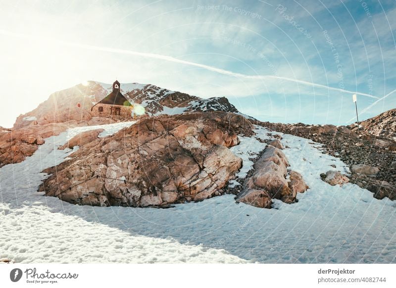 Stopover at the Zugspitze with chapel in the back light Snowscape Structures and shapes Austria Environmental balance Polluter Destruction Glacier