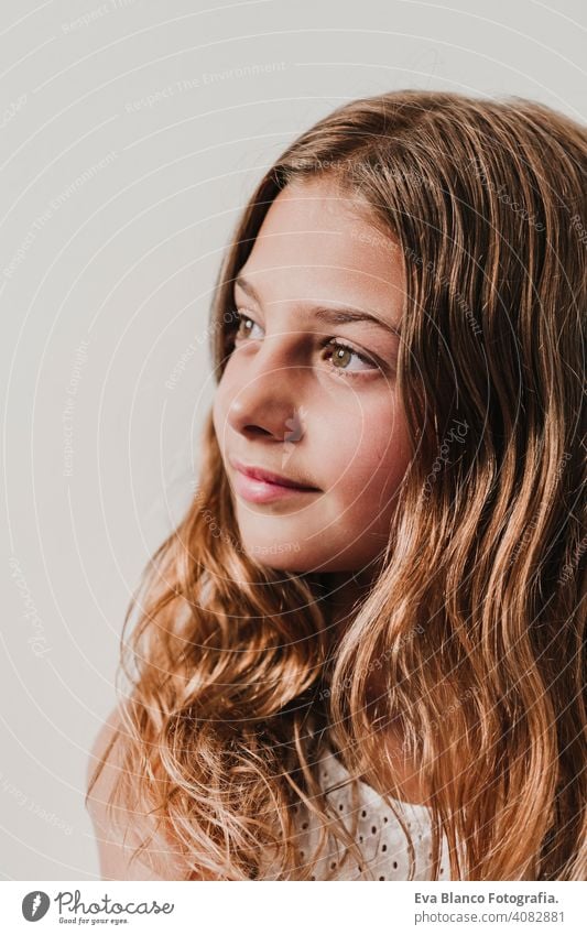 Portrait of beautiful teenager girl at home. Looking by the window. white background. Happiness and lifestyle concept child tourism smile happy people female