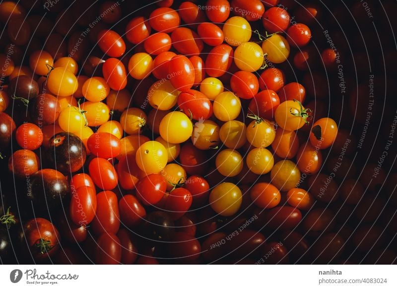 Texture of many cherry tomatoes harvest organic bio mix variety color yellow orange kumato gradient texture harvesting farm health vegetable fruit sun sun ligth