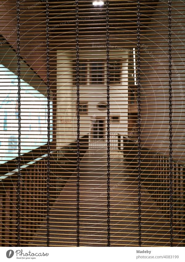 Lowered lattice in the evening in front of a modern passate at the old town at the Römerberg in Frankfurt am Main in Hesse Grating roller grilles Safety Passage