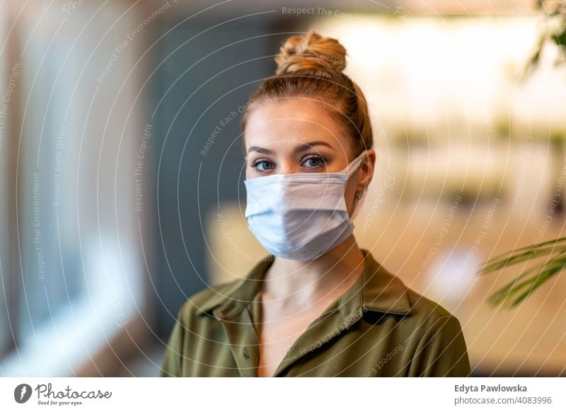 Woman wearing protective face mask in the office for safety and protection during COVID-19 woman girl people Entrepreneur business businesswoman successful