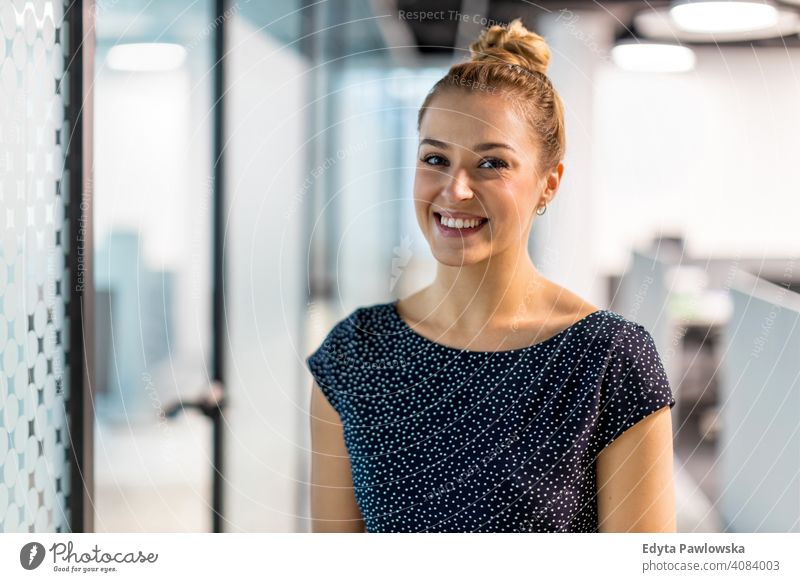 Portrait of confident young businesswoman standing in office girl people Entrepreneur successful professional adult female lifestyle indoors millennial