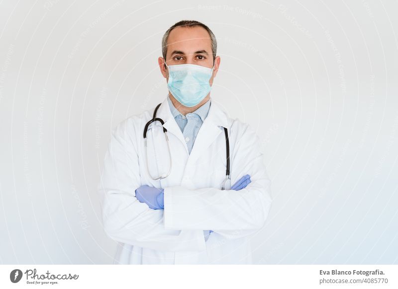 portrait of doctor wearing protective mask and gloves indoors. Corona virus concept man professional corona virus hospital working infection safety epidemic