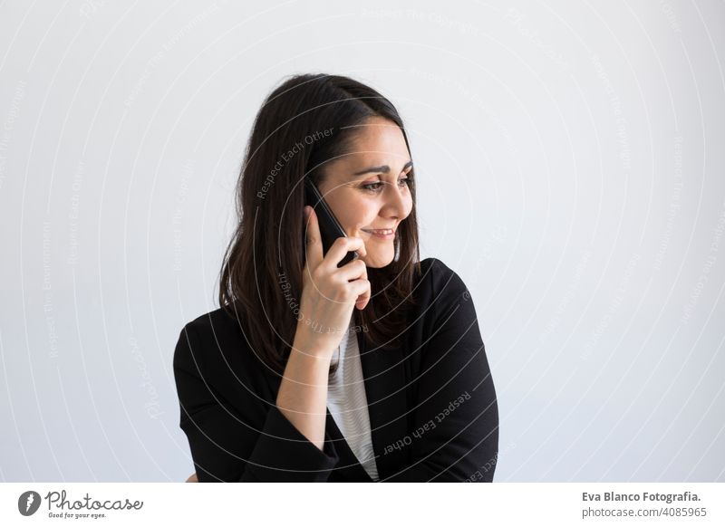 beautiful young business woman talking on her mobile phone and smiling. white background. business concept. Lifestyles computer office laptop worker