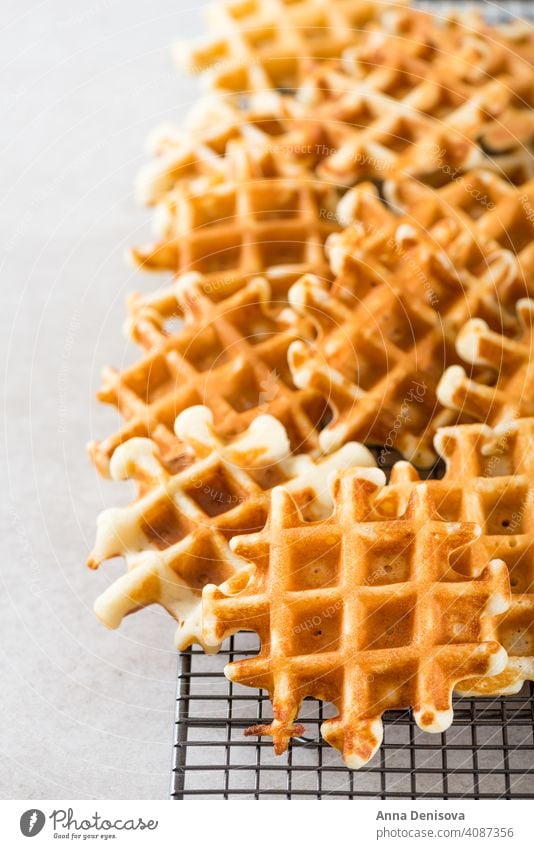 Traditional homemade belgian waffles on light background breakfast dessert blueberry raspberry syrup baked sweet fresh pastry belgium delicious snack bakery