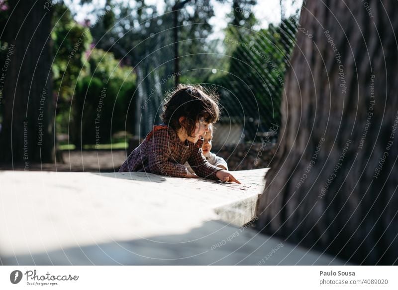 Brother and sister playing outdoors Brothers and sisters Caucasian 1 - 3 years Boy (child) Girl Family & Relations Curiosity Authentic Together togetherness