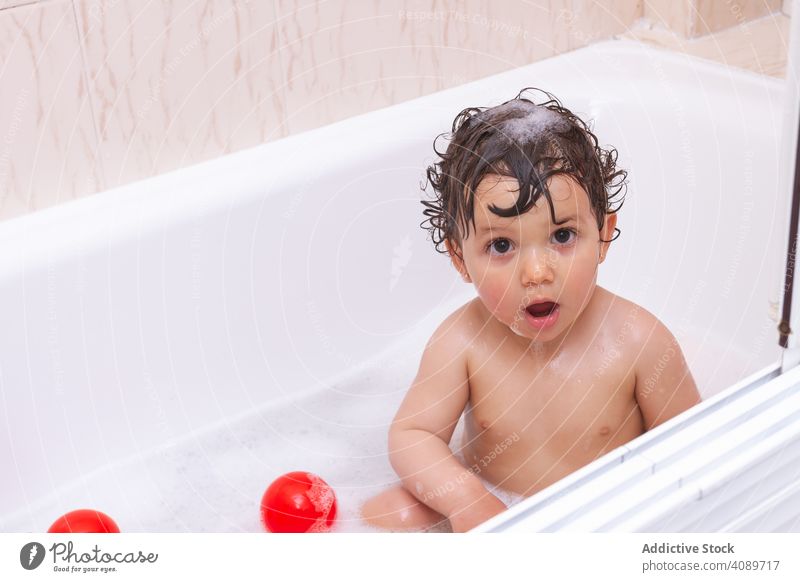 Funny baby taking a bath bathroom wet shower funny home little care kid child adorable cute healthy bathing cozy hygiene joy innocence pleasure daily routine