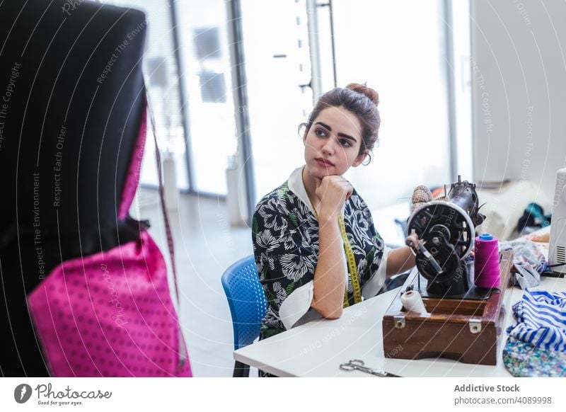 Teenage girl in a sewing school woman class classroom teenager clothing embroidery fabric factory job machine pattern profession seamstress student studio