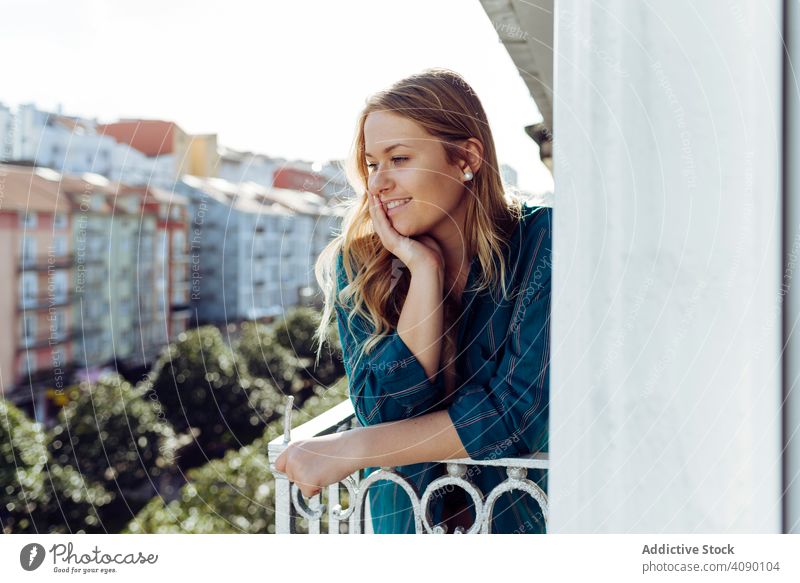 Young woman looking away on balcony railing leaning terrace young female joy beautiful attractive pretty charming sensual cool seductive gorgeous appealing slim