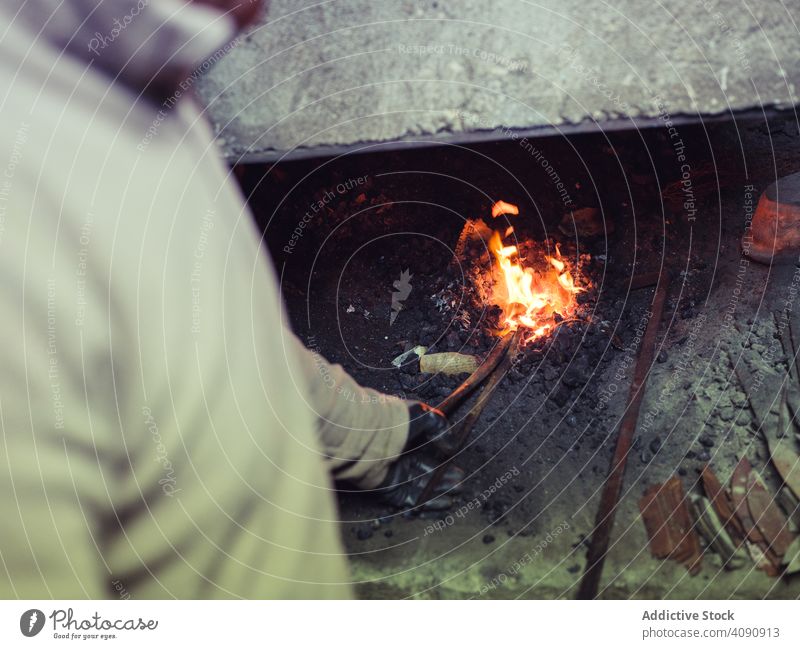 Blacksmith hands forging molten metal on anvil blacksmith hot hammer equipment tools traditional smithy workshop craft farrier old skill heavy metalwork