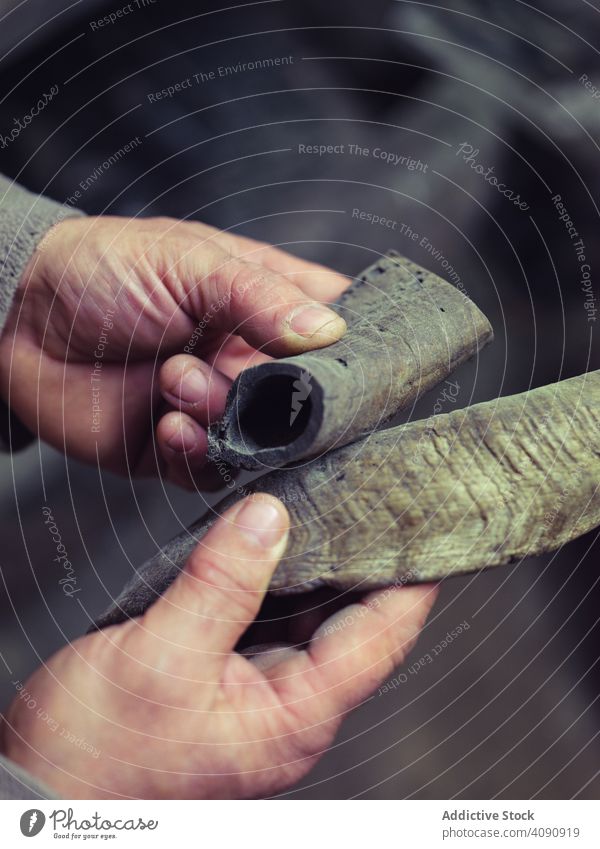 Smith hands holding metal after fire blacksmith traditional smithy workshop forge craft farrier skill heavy metalwork handwork worker manufacturing manual