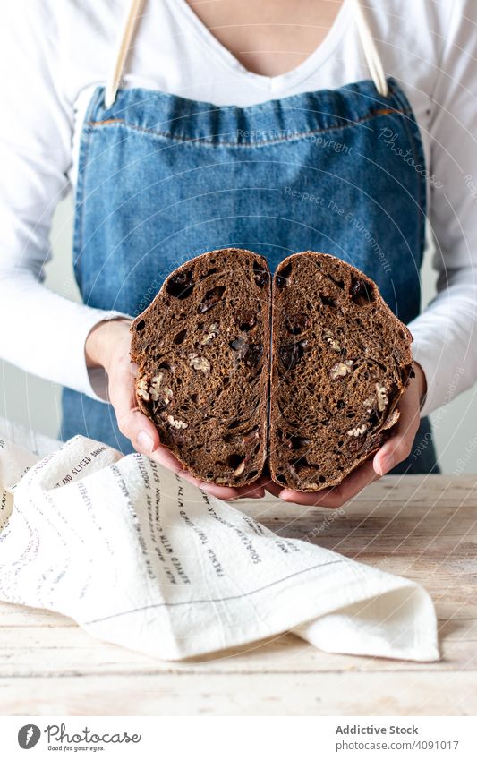 Hands of woman holding rye bread hands food kitchen bakery female homemade fresh dough chef cook ingredient table flour wheat preparation pastry cooking person