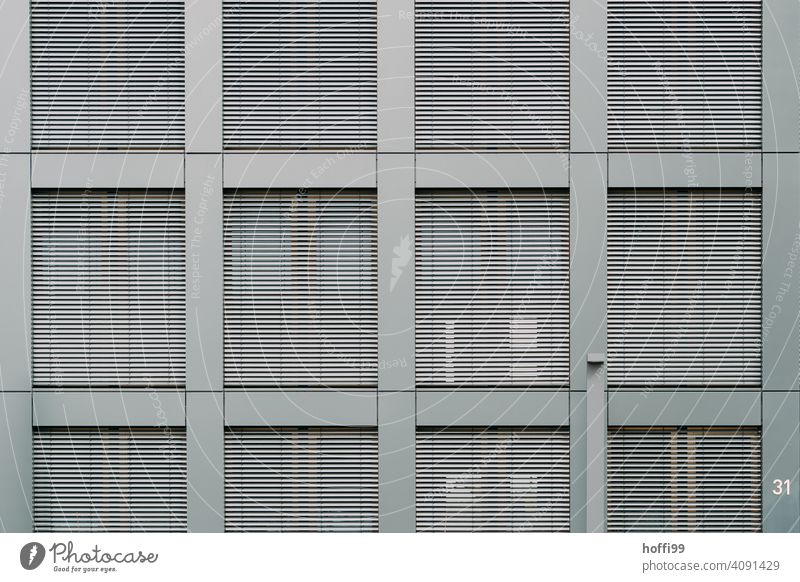 Modern exterior facade with closed blinds Venetian blinds Disk Slat blinds Window Contrast Modern architecture Closed Architecture Facade Roller shutter