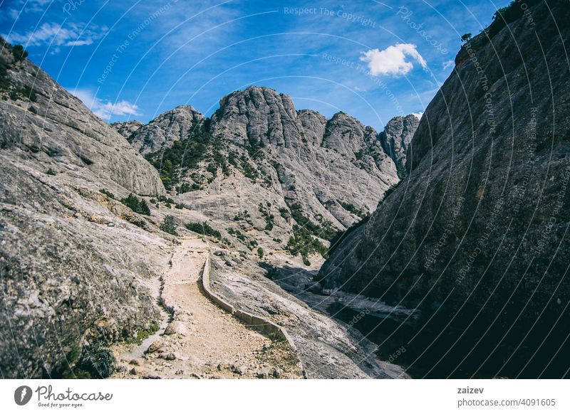 calm stream with many stones on the path eroded layered canyon nature outdoors travel destinations mountain spain tarragona descent moment moody sad stormy