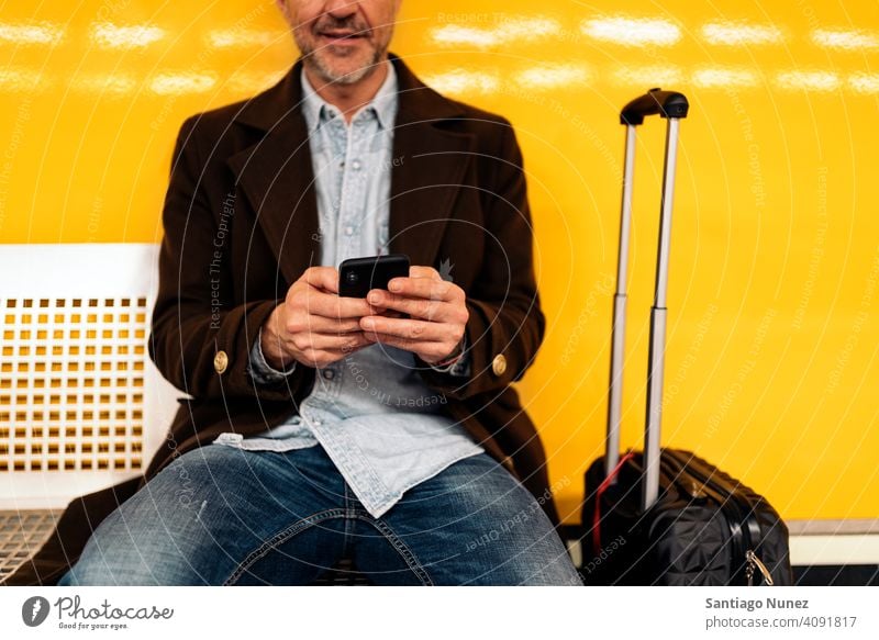 Close up of a business man using smartphone. person lifestyle people middle aged handsome senior caucasian city adult male portrait casual urban confident