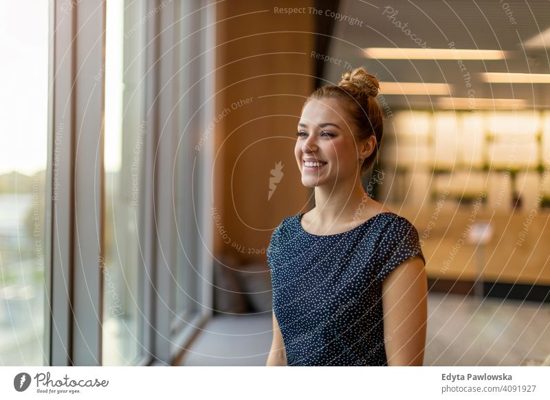 Portrait of confident young businesswoman standing in office girl people Entrepreneur successful professional adult female lifestyle indoors millennial