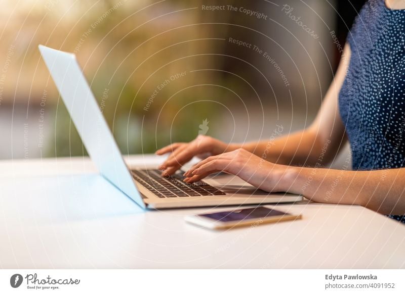 Shot of a young businesswoman with laptop in her office girl people Entrepreneur successful professional adult female lifestyle indoors millennial attractive