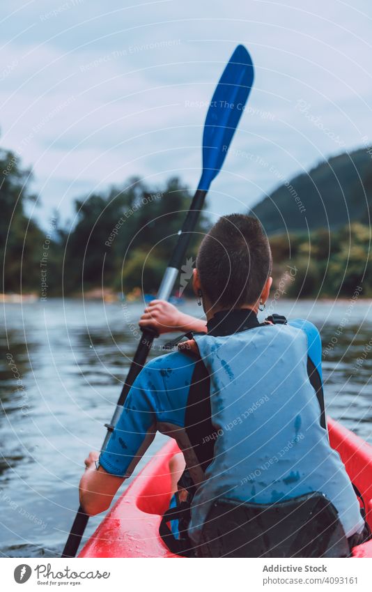 Female kayaking with paddle in raised hands woman winner competition sport sella river spain water canoe activity tourism adventure lifestyle travel female