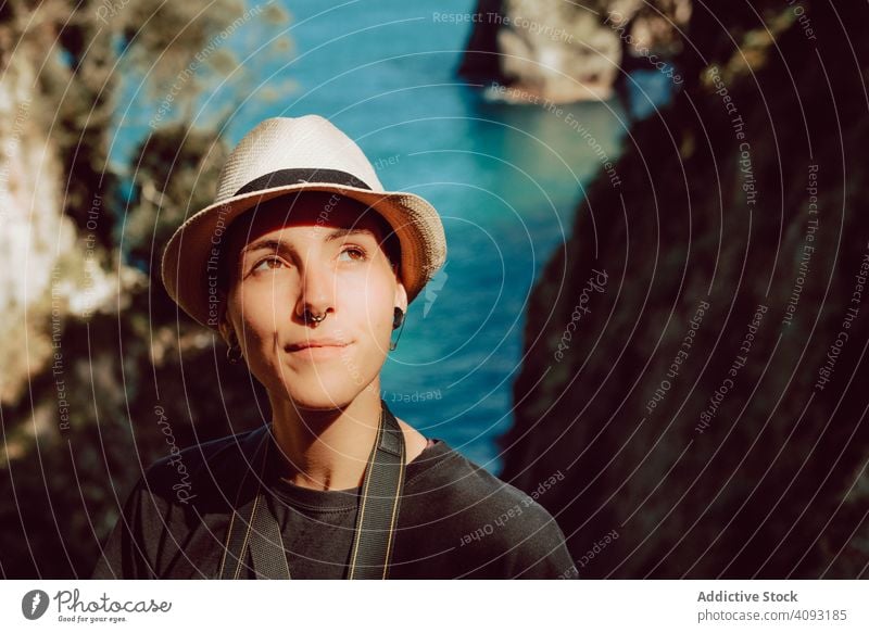 Female tourist contemplating landscape on daytime woman tourism travel sea rock ribadedeva asturias spain trip vacation destination female casual inspired