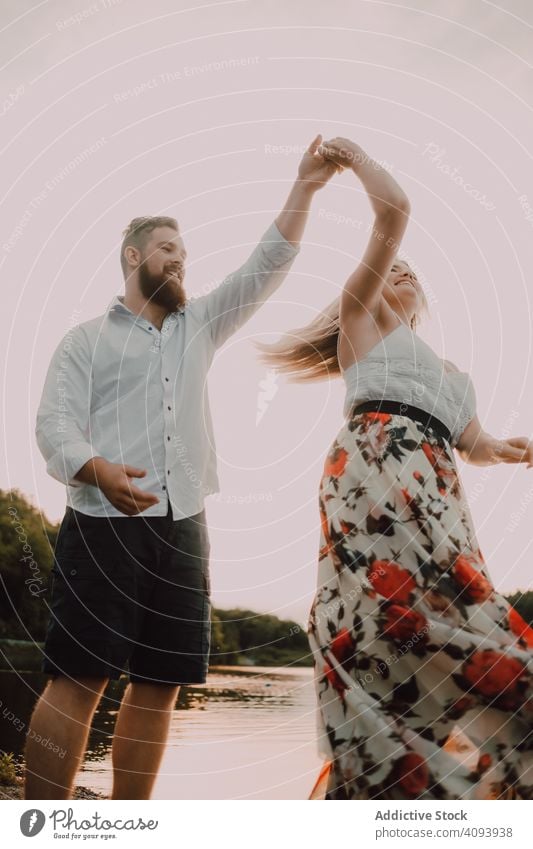 Loving couple standing ankle deep in water on beach hug love lake tender shore adorable embrace coast vacation nature honeymoon caress together affection