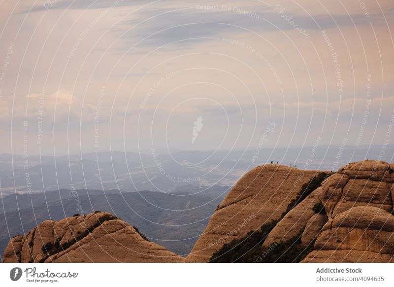 Climbers climbing the mountain of Montserrat, wild danger safety dangerous rocky trekking summer hiker extreme active hiking vertical adventure activity tourist