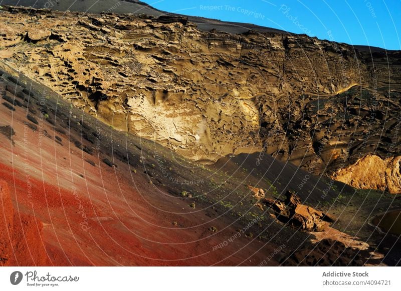 Picturesque view of volcanic terrain with solidified lava in wild area landscape deserted island burnt spain nature picturesque travel horizon scenic slope