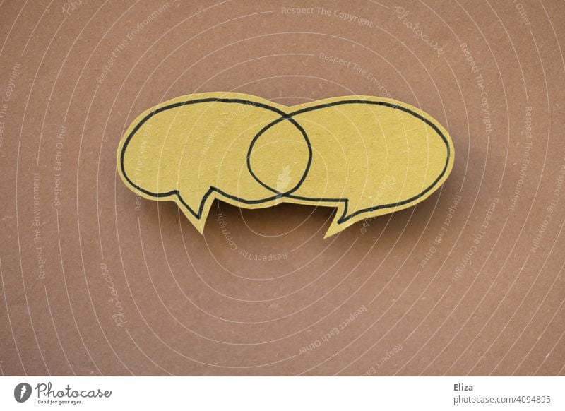 Two speech bubbles with an intersection. Communication, discussion and dialogue. communication To talk togetherness Speech bubbles Smiley two cutting quantity