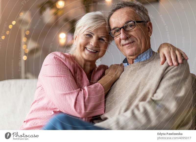 Happy senior couple at home people woman adult mature casual attractive female smiling happy Caucasian toothy enjoying two people love relationship portrait