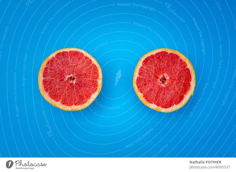 Top view two half yellow grapefruit on blue background pomelos grapefruit slice Citrus fruits orange Food Fresh Grapefruit Healthy Eating Nutrition Close-up