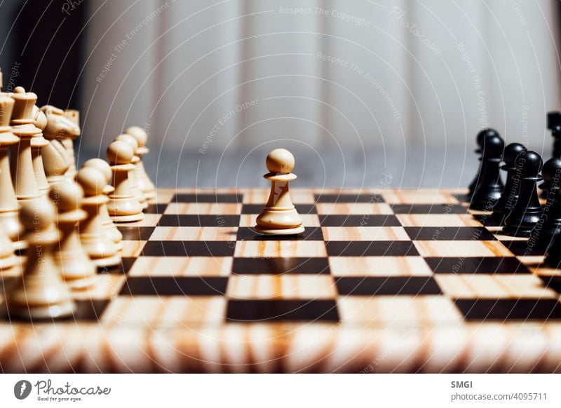 Lonely white pawn starting chess game competition strategy success play intelligence piece challenge knight victory black chessboard leadership move power