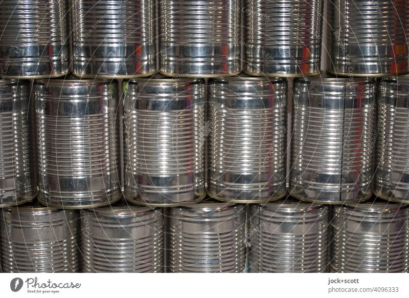 Rows of tins without label Glittering Symmetry Classification Containers and vessels Structures and shapes Collection Design Detail Aluminium Metal Many Stack