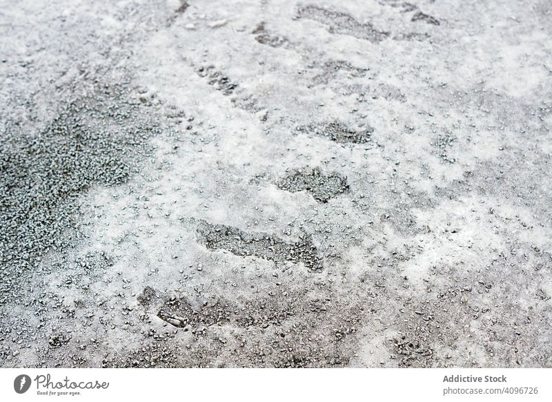 Pile of frosted pebble on ground pile texture small frozen rock grey icy snow natural abstract cobble dark boulder gravel material heap winter background