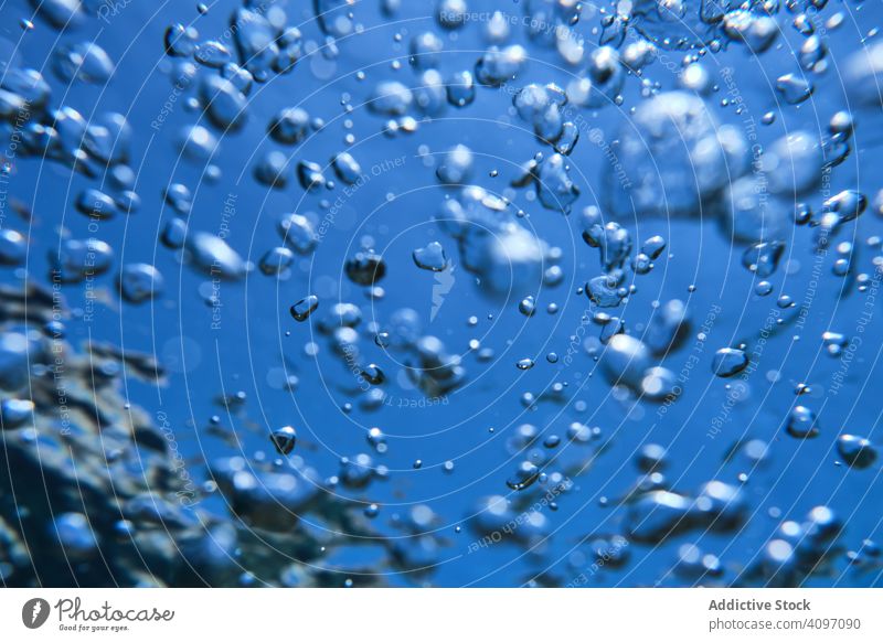 Popping up air bubbles in sea water background clear underwater clean oxygen purity breathe smooth motion fresh surface ocean transparent drop submerged dive